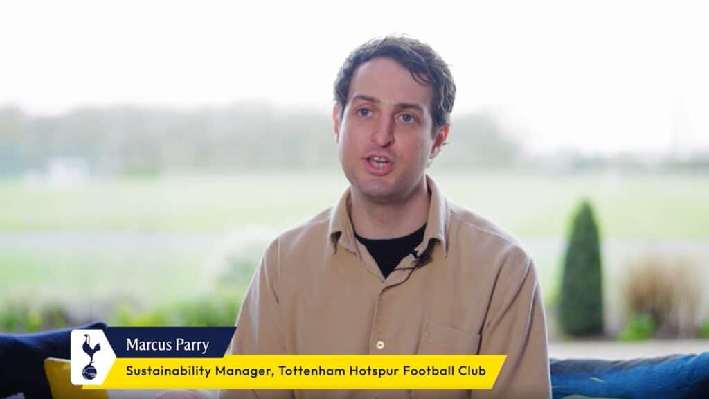 Marcus Parry, Sustainability Manager for Tottenham Hotspur Stadium and Football Club, speaking to the camera in a casual setting.